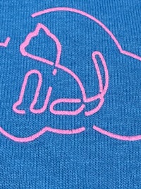 a blue towel with a pink hand drawn on it