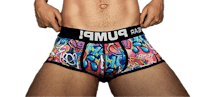 a man is posing in a colorful boxer brief