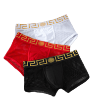 three men's boxer briefs with greek design