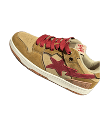 a tan and red sneaker with a star on it